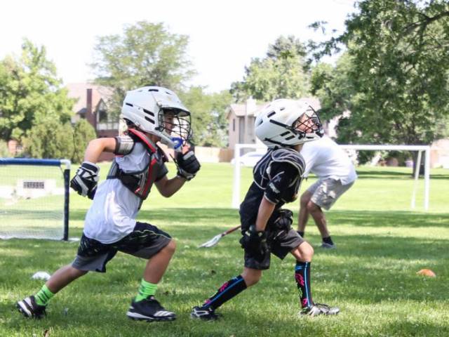 Boys Playing Lacrosse at Dream Big Summer Day Camp | Hilltop Denver and Greenwood Village