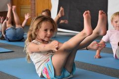 Girl Practicing Yoga at Dream Big Summer Day Camp | Hilltop Denver and Greenwood Village