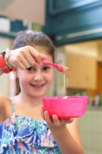 Girl Showing Her Cooking Skills at Dream Big Summer Day Camp | Hilltop Denver and Greenwood Village